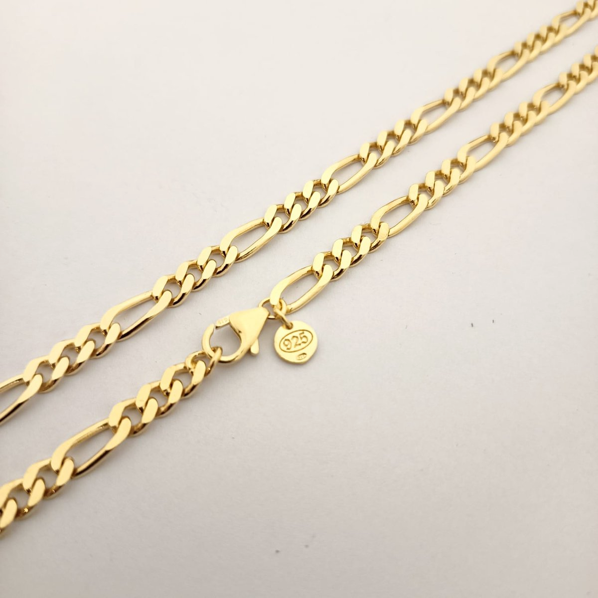 Dettaglio catena grumetta 3+1 da uomo in argento 925 placcato oro con chiusura a moschettone, ViMon Gioielli