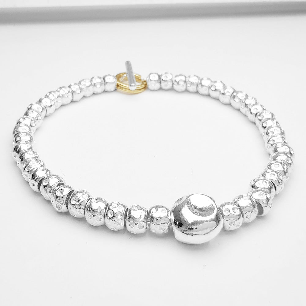 Bracciale granelli con pepita centrale