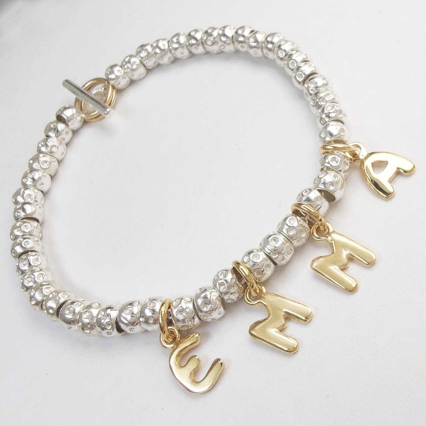 braccialetto imitazione simil tipo dodo pomellato con mini granelli rondelle ciondoli lettere alfabeto nome emma figli prezzo scontato offerta outlet