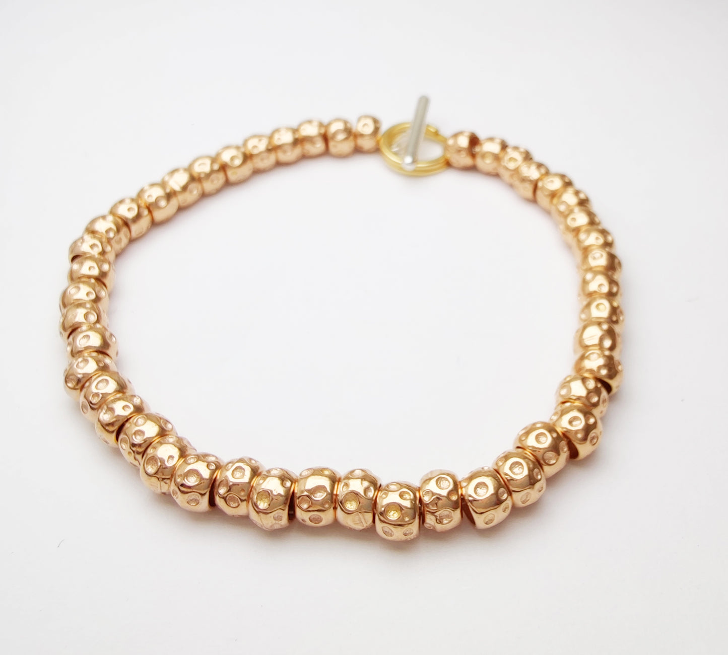 bracciale simil imitazione tipo dodo mariani con granelli oro rosa 