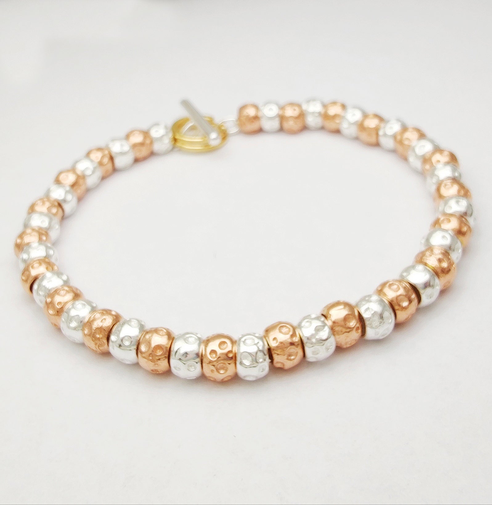 bracciale da donna in argento con granelli bicolore argento oro rosa lunghezza personalizzata ciondoli charm pendenti tipo simil dodo mariani prezzo scontato in offerta