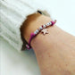 donna indossa bracciale cordino cerato fucsia con pendente stella marina simil imitazione dodo