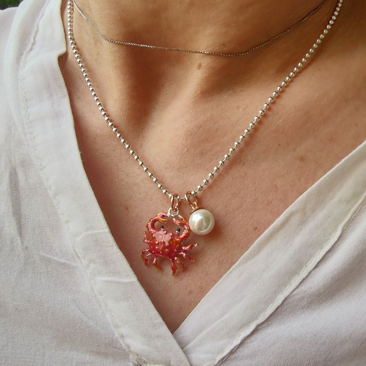 Collana ciondoli granchio e perla