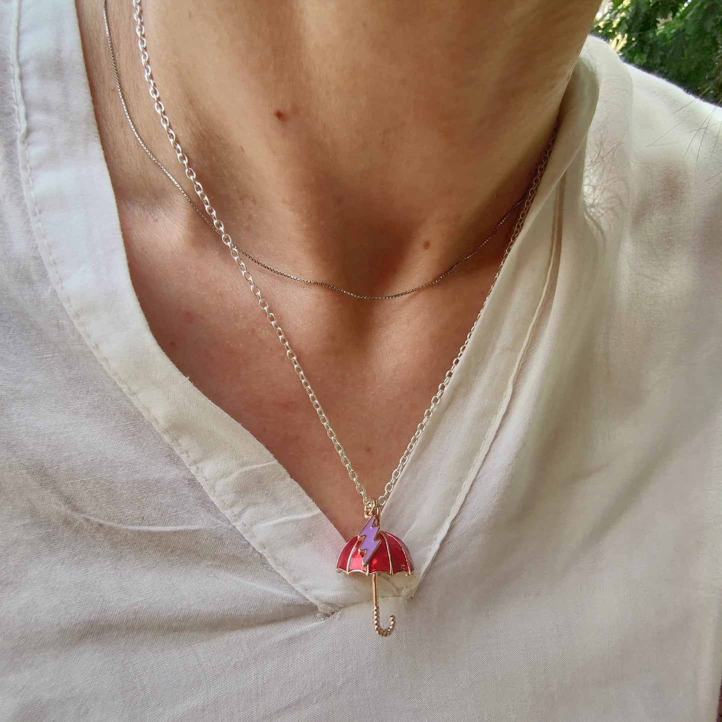 Collana ombrello e fulmine